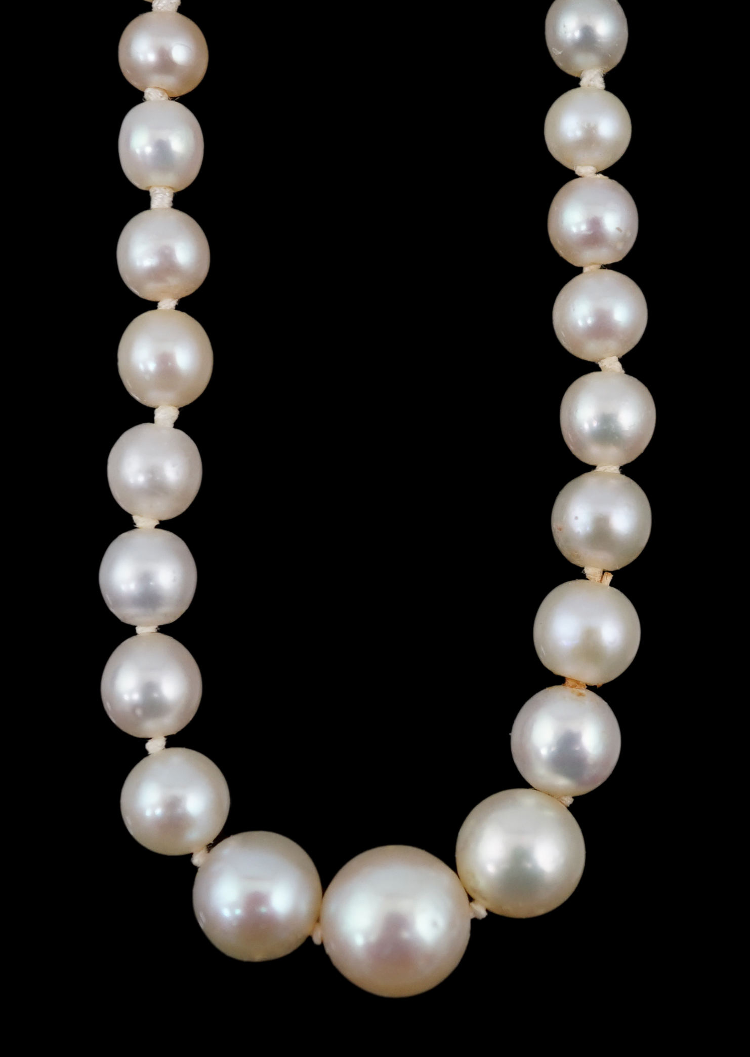 An early 20th century single strand graduated natural pearl and seed pearl necklace, with three stone diamond set clasp and Anchor Cert report dated 27/6/2014 stating an extensive sample to be natural pearls